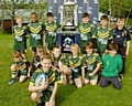 UNDER NINES captain Sam Ratcliffe with his team and the cup 