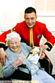 SPECIAL delivery . . . Kyle hands his great-gran Amy her card from the Queen 
