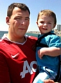 FAMILY man . . . Lee with son Jack and (left) after his passing-out parade 
