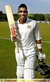 SUPER SHOW . . . Denis Louis takes the plaudits after his record-breaking knock against brave Oldham. 