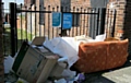 ILLEGAL: the fly-tipping - directly under the no tipping sign 
