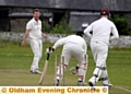 Friarmere batsman Atif Khan is bowled by Saddleworth bowler Peter Skuse. 