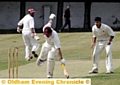 FULL STRETCH . . . Royton batsman Ali Muzaffer, who made an unbeaten 77, survives a run-out scare. 