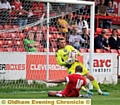THAT’S MINE . . . Athletic goalkeeper Mark Oxley grabs the ball close to his chest to deny Accrington’s Danny Webber. 
