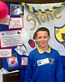 PROUD . . . Brandon Taylor with the Francis House display he made to inspire his fellow pupils 
