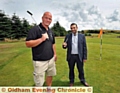 PUTT IT THERE: Mark Cumiskey of Pennine Golf and Councillor Shoab Akhtar at Bishop Park 

