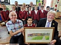 HAPPY memories . . . (front, from left) artist David Ford, pupil Sol Dean and Christine Taylor’s husband, Jack, with the painting. 
