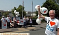 MANY happy returns . . . Michael Meacher helps the NHS to celebrate its 65th birthday at the Royal Oldham Hospital on Friday 

