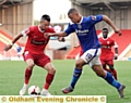 HANDFUL . . . Jonson Clarke-Harris surges forward.