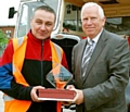 CONGRATULATIONS . . . Jason Gartside (left) is presented with his regional award by Stagecoach Manchester managing director Christopher Bowles 

