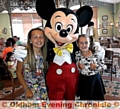 Chanel Murphy (right) met Mickey Mouse when her late mother Natalie’s dream of sending her on holiday was fulfilled. She is pictured with her friend Molly Moynihan 
