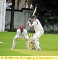 PREPARING TO STRIKE: Werneth captain Matt Taylor winds up from a delivery from Crompton’s Carl Taylor (main). 