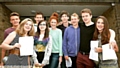 MOMENT of truth . . . Saddleworth School pupils with their results 
