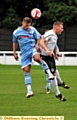 AIR RAID . . . Mossley defender Kyle McGonigle (white shirt) battles for aerial supremacy during last Saturday’s 3-1 defeat to Kendal Town. 
