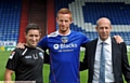 SIGNED, SEALED AND DELIVERED . . . Adam Rooney with Athletic boss Lee Johnson (left) and chairman Simon Corney. 
