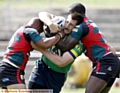 OLDHAM’S Phil Joy is caught in a headlock as he attempts to make ground. 