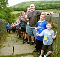 THIRSTY work . . . Bryn Hughes and his supporters raise a glass at a fundraising trek at Marsden flight, near Butterley Reservoir 
