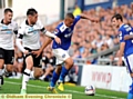 Jonson Clarke-Harris holds off Richard Keogh. Pictures by ALAN HOWARTH 
