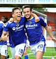 plenty to smile about . . . Charlie MacDonald (left) and Jose Baxter show their delight at Stevenage on the opening day of the Sky Bet League One season. 