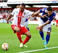 CHARLIE MacDONALD (right) proved a handful for Stevenage. 