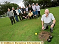 ROUGH patch: club captain Malcolm Talbot (front) and his fellow team mates on the damaged green 