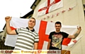 Jamie Robinson and Ryan McCallion fly the flags in Delph Lane, Delph.
