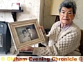 DISTRAUGHT . . . Carolina Way with a photograph of herself and her husband, Clifford, who is now recovering from an operation in the Royal Oldham Hospital