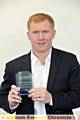 Paul Scholes shows off his Sports Achievement Award.
