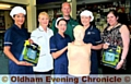 Kitchen staff Caroline Vongeyer, Lauren Kelly, Ashleigh Chastney, Pam Morris, school nurse Kat Watson and Steve Nicholls with the new defibrillators and a dummy