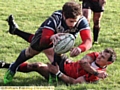 TOUCHING DOWN: Ashley Dixon evades a despairing tackle by a Keighley Albion opponent to score Hollinwood’s opening try