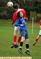 GO FOR IT: Cartshaft’s Lee Diggle (blue shirt) is beaten to a header. PICTURES by TIM BRADLEY.