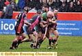 Jason Clegg takes the ball in for the Legends team.