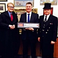 Nick Howard (centre) receives his award from officials at a ceremony where he was given the Freedom of the City of London