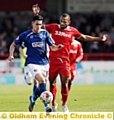 RUNNING BATTLE: Conor Wilkinson tries to beat a Crawley rival.