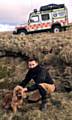 Oldham Mountain Rescue members with the no-doubt grateful dog
