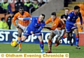 EYES ON THE BALL . . . Rhys Murphy displays determination to hold off a Blackpool defender. 