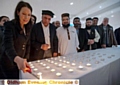 Candlelit vigil in memory of Lahore bomb blast victims: Debbie Abrahams MP lights a candle. Next to her is Abdul Basit Shah (Oldham Mosques Council) and Mufti Helal (officer for Oldham Mosques Council). 