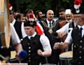 THE Oldham Scottish Pipe Band leads the Mayor, Cllr Shadab Qumer, to the Pakistani Community Centre