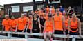 MOSSLEY Running Club member Michelle Phillips sitting on the wall with husband Chris and other members of the club