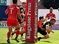 OVER THE LINE: Oldham's Michael Ward powers through to register a try