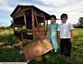 UPSET . . . pupils Noor Al-Haya (left) and Mohammed Ayaan with the vandalised chicken coop