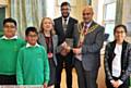 FAREWELL. . . Surprise guest the Mayor of Oldham makes a presentation to head teacher Irene Barratt with (from left) deputy head boy Fehzaan Ahmed, head boy Taseen Miah, Youth Mayor Marouf Ahmed and next year's head girl Fathimah Ali