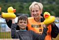Saddleworth Show at Well-I-Hole Farm, Greenfield. Pictured here (l-r) Stevie Gregory (10) gets ready for the Rotary Club of Saddleworth duck race with Gill Bussey of Rotary Club of Saddleworth
