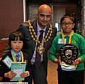 OLDHAM'S Mayor Councillor Shadab Qumer with runner-up, St Margaret's pupil Yi-Lin Yu (left) and winner Abid Ali