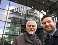 MP Jim McMahon (right) with Chadderton councillor Colin McLaren outside Transport for Greater Manchester offices