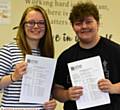 DELIGHT . . . Hulme Grammar School students Alexandra Sledge (3A* and 1A) and Jake Scott (3A* and 2A)