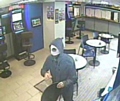 MASKED robber enters the betting shop
