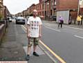 WORRIED . . . Mark Ellis on Coalshaw Green Road, Chadderton, where his  daughter Chloe was knocked down by a car