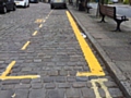 The lines, marking out a new hackney carriage rank in Uppermill's cobbled square.