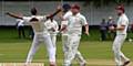 FIRST BLOOD . . Opening bowler Aqib Zulfiqar receives the acclaim of his Crompton teammates after trapping Rochdale's Ben Chapman leg before in the second over of the match.